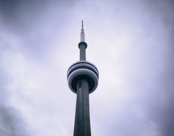 Low angle view of communications tower against sky