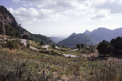 Scenic view of landscape and mountains against sky