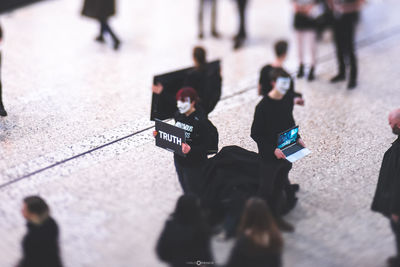 High angle view of people walking on street