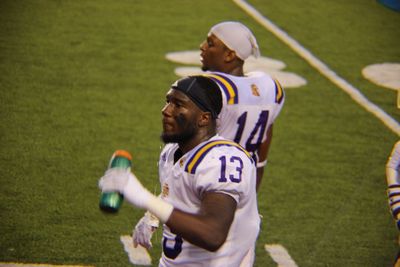 Side view of a man standing on field