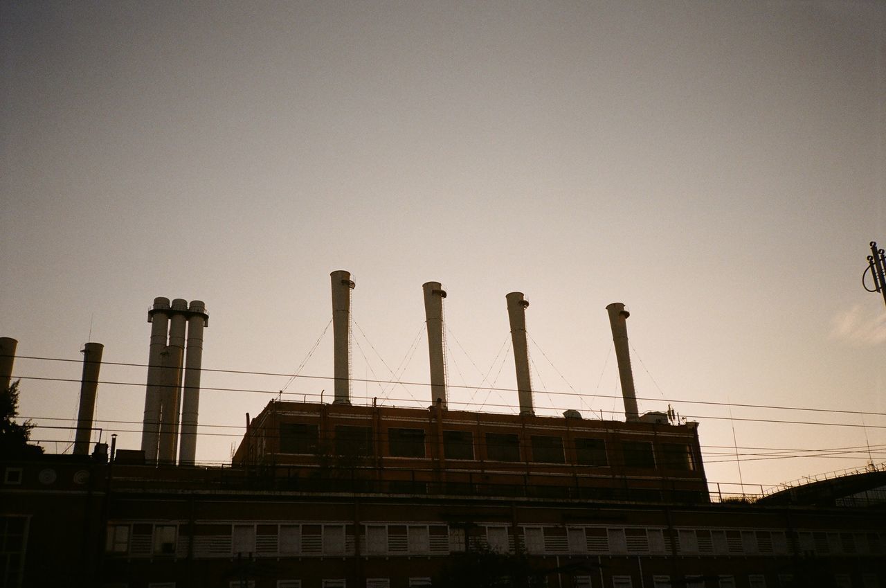 LOW ANGLE VIEW OF BUILDINGS AGAINST CLEAR SKY