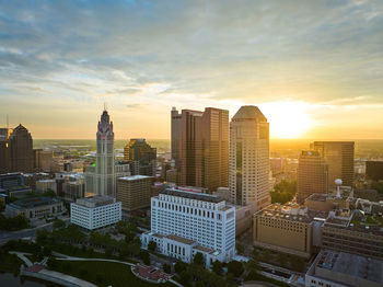 Cityscape against sky during sunset