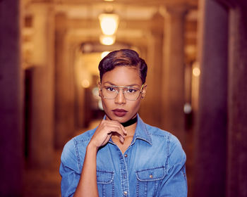 Portrait of confident woman standing indoors