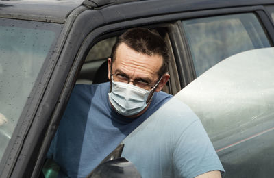 Portrait of man in car