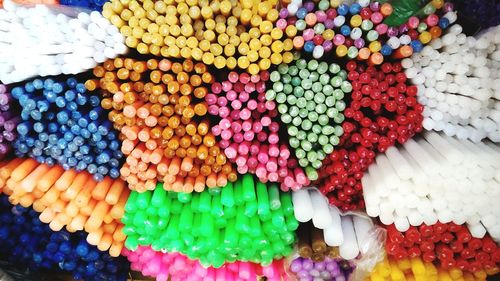 Close-up of colorful candles at market stall