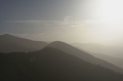 Scenic view of silhouette mountains against sky