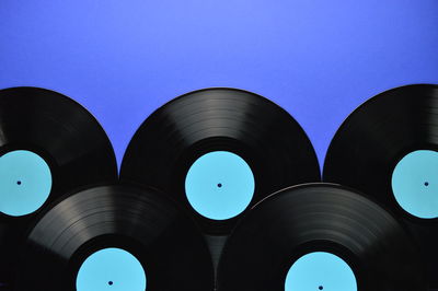 Close-up of records against blue background