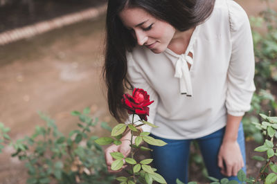 Close-up of woman holding flowers