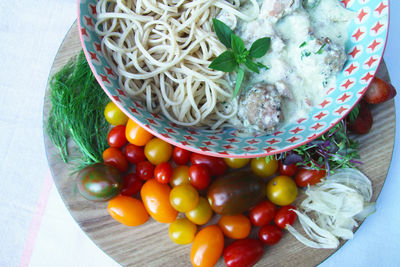 High angle view of vegetables in basket on table