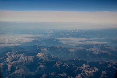 Aerial view of mountains against sky