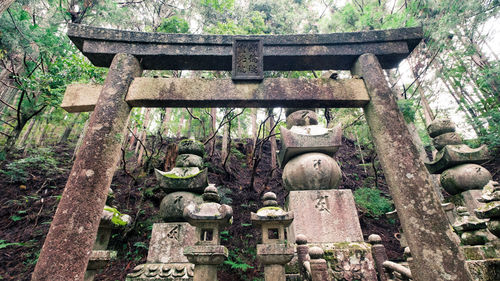 Old stone temple against trees