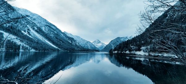 Scenic view of snowcapped mountains against sky