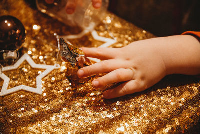 Close-up of hand holding christmas decoration