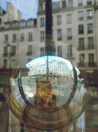 Reflection of buildings on glass window