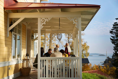 Mature friends spending leisure time on porch