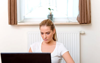 Young woman using mobile phone
