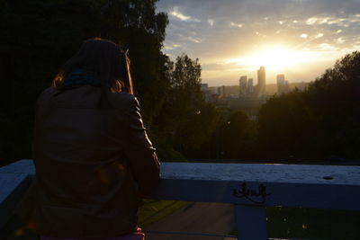 Rear view of man at temple against sky
