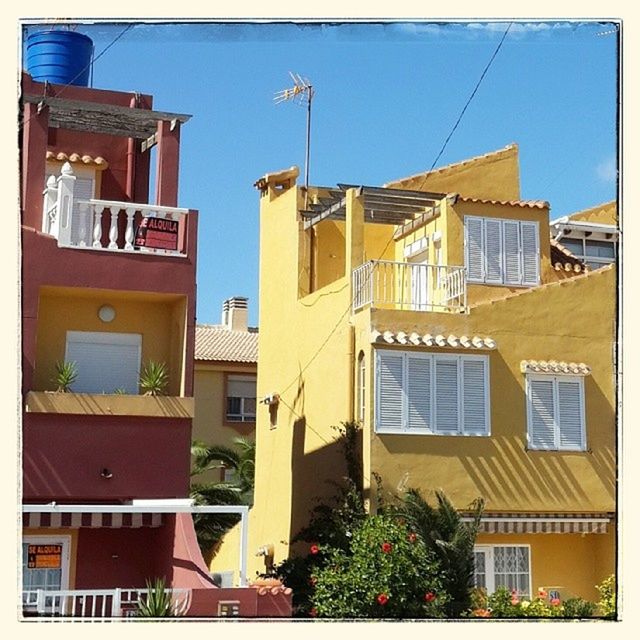 building exterior, architecture, built structure, residential building, residential structure, house, window, clear sky, city, low angle view, building, transfer print, blue, balcony, residential district, day, sunlight, apartment, auto post production filter, tree