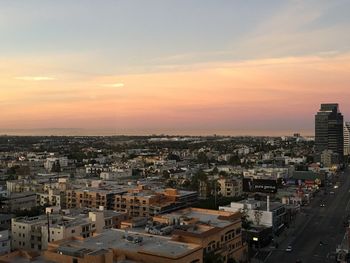 High angle view of city at sunset