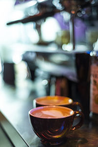 Close-up of coffee served on table at cafe