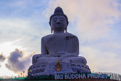 Low angle view of statue against sky