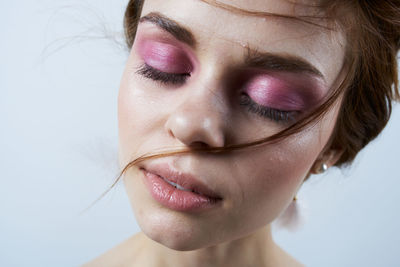 Close-up portrait of beautiful young woman