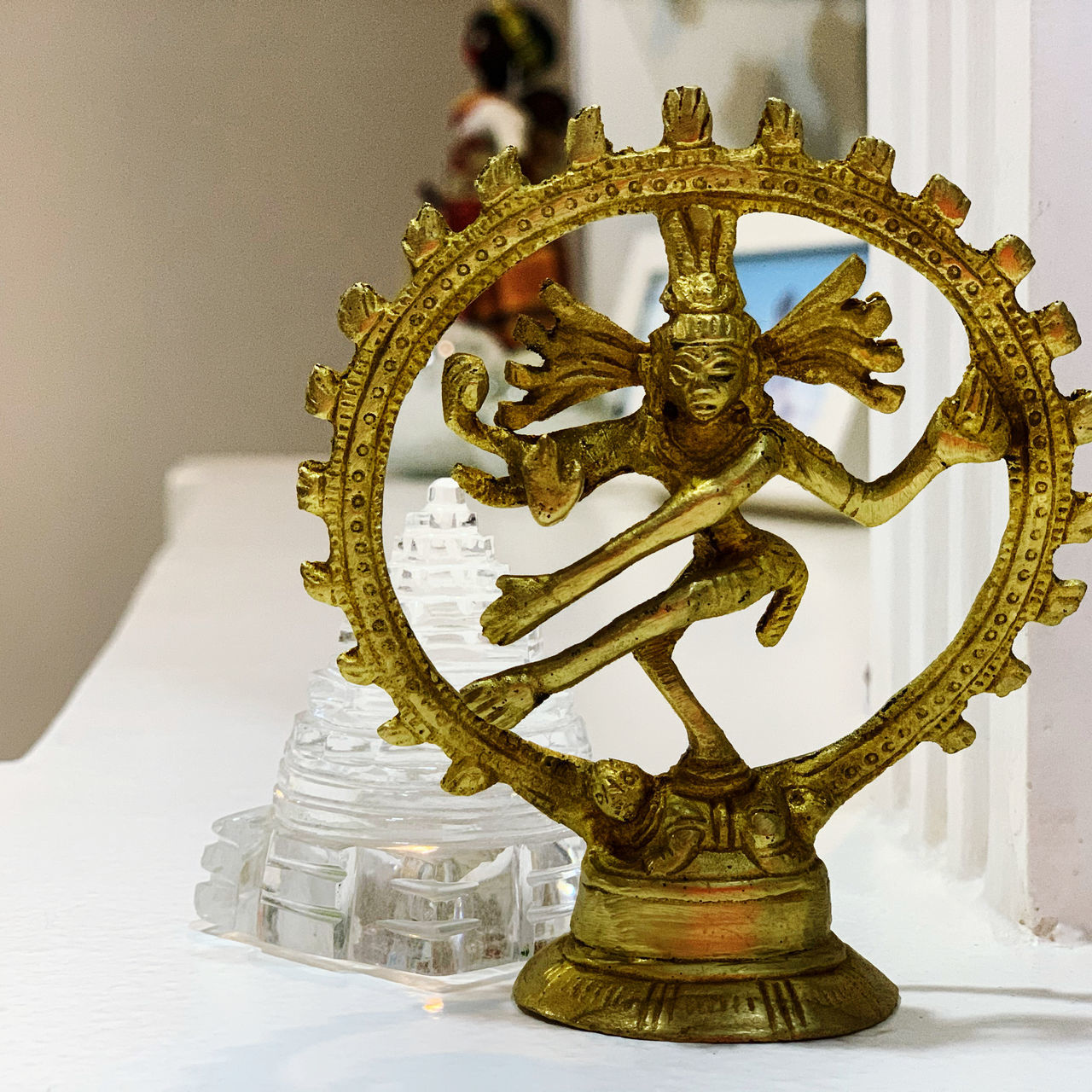 CLOSE-UP OF STATUE ON TABLE AT HOME