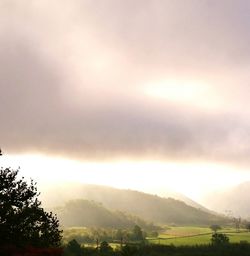 Scenic view of landscape against dramatic sky