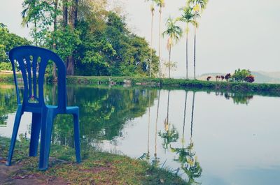 Scenic view of lake against clear blue sky