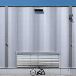 Bicycle parked in front of building