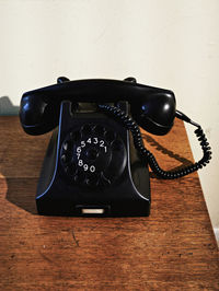 Close-up of telephone on table