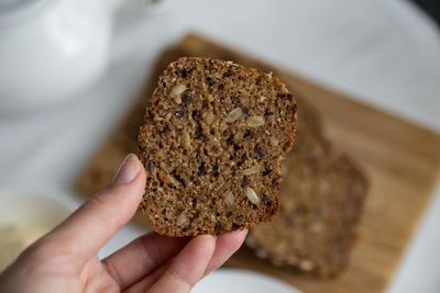 Close-up of hand holding bread