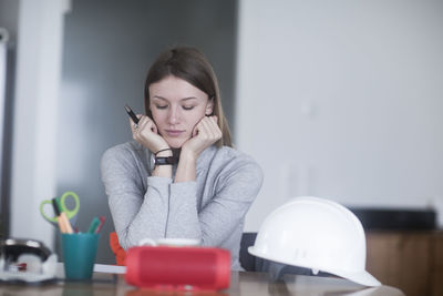 Young woman with long hair learning at home