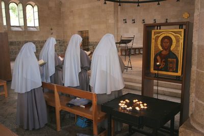 View of praying nuns, church of the multiplication of the loaves and the fishes, tabgha, israel