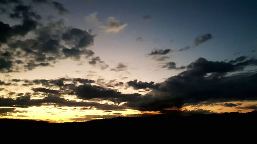 Low angle view of dramatic sky during sunset