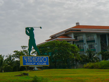 Information sign on land against sky