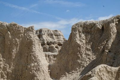 Low angle view of rocks against sky