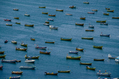 High angle view of sailboats sailing in sea