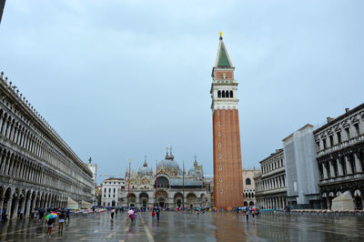 Group of people in front of clock tower