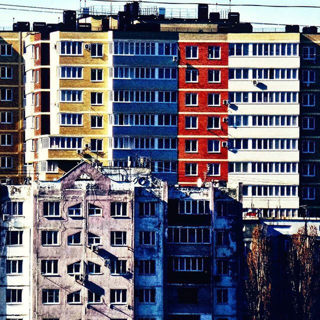 building exterior, architecture, built structure, city, window, building, residential building, residential structure, apartment, office building, modern, low angle view, in a row, balcony, residential district, city life, repetition, day, outdoors, glass - material