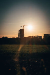 Scenic view of field against sky during sunset