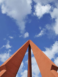 Low angle view of building against cloudy sky