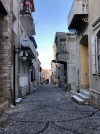 Narrow alley amidst buildings in town