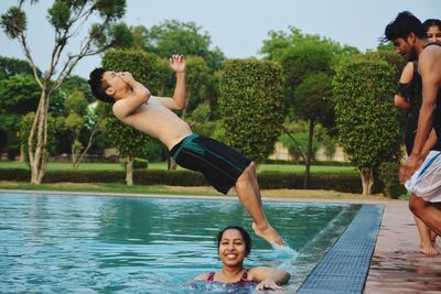 View of people playing poolside