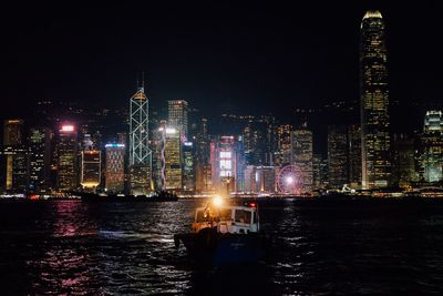 Illuminated buildings in city at night