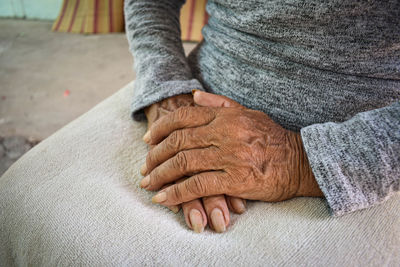 Midsection of woman with hands