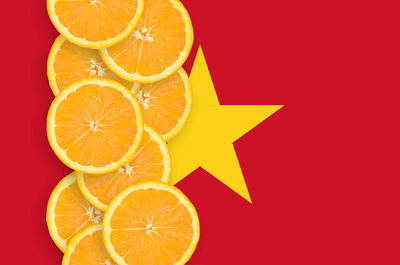 Orange fruit against white background