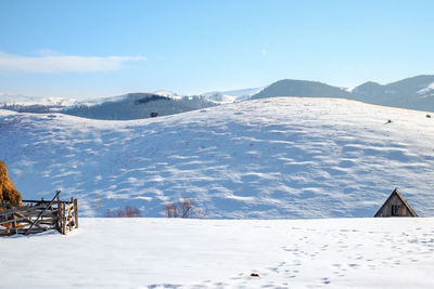 Sun over the winter mountains with snow, cindrel mountains, paltinis, romania