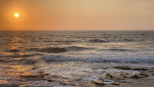 Scenic view of sea against sky during sunset