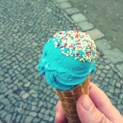 Close-up of hand holding ice cream